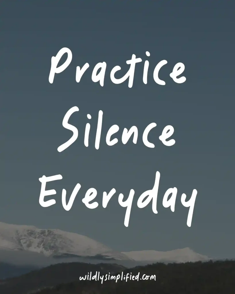 "Practice Silence Everyday" text on a dark blue sky with mountains underneath