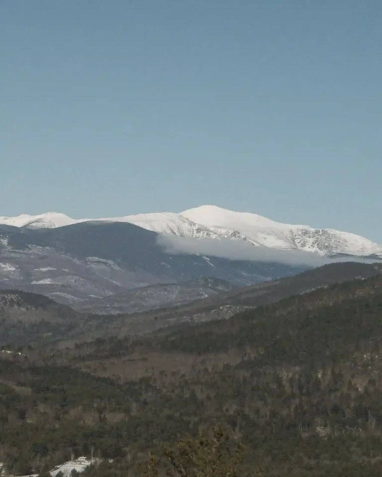 Featured image for how to practice silence with a winter landscape of a mountain range covered in snow