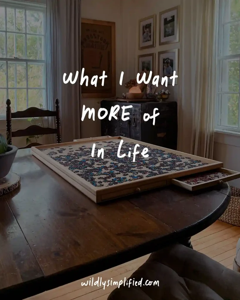 "What I want MORE of in life" in white text overlayed on an image of a puzzle table set up in a dining room
